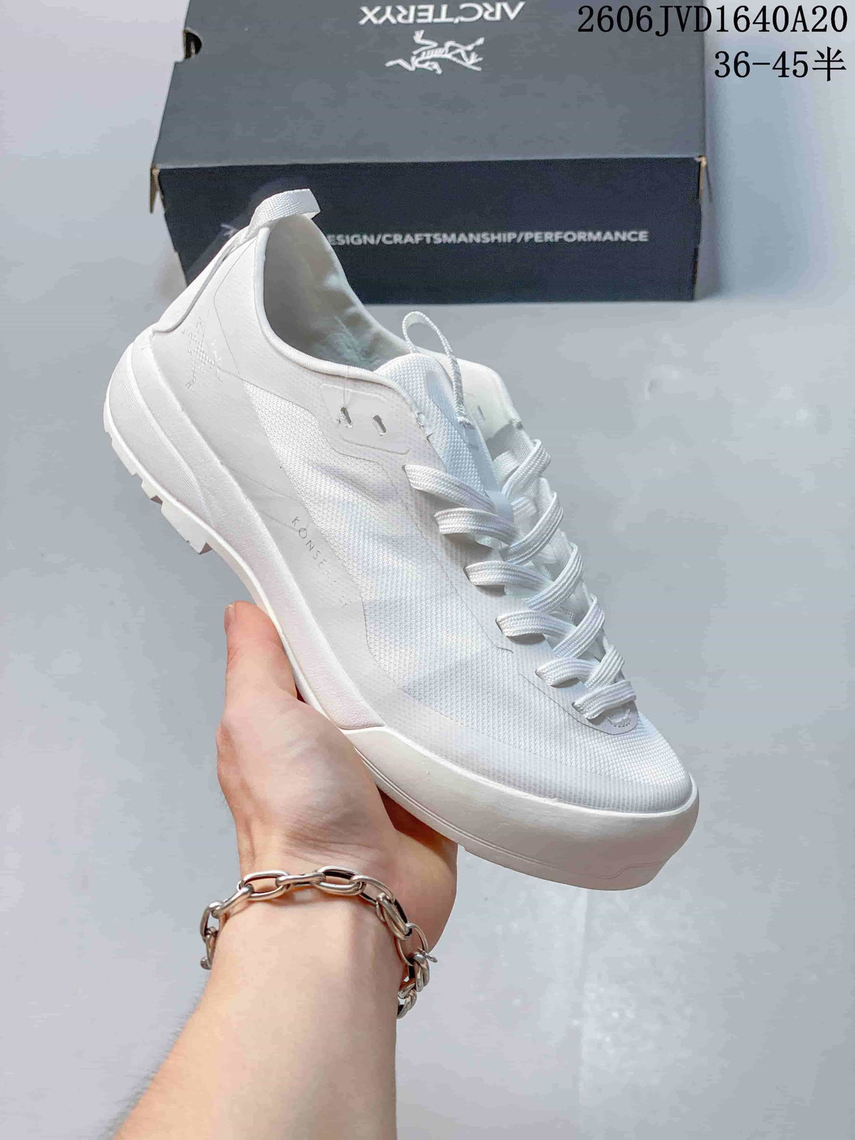 All-white Arc'teryx Konseal LT trail shoe shown from the side.