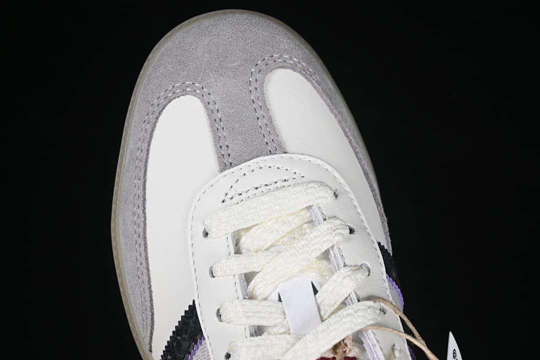 Top view of gray toe overlays and white laces