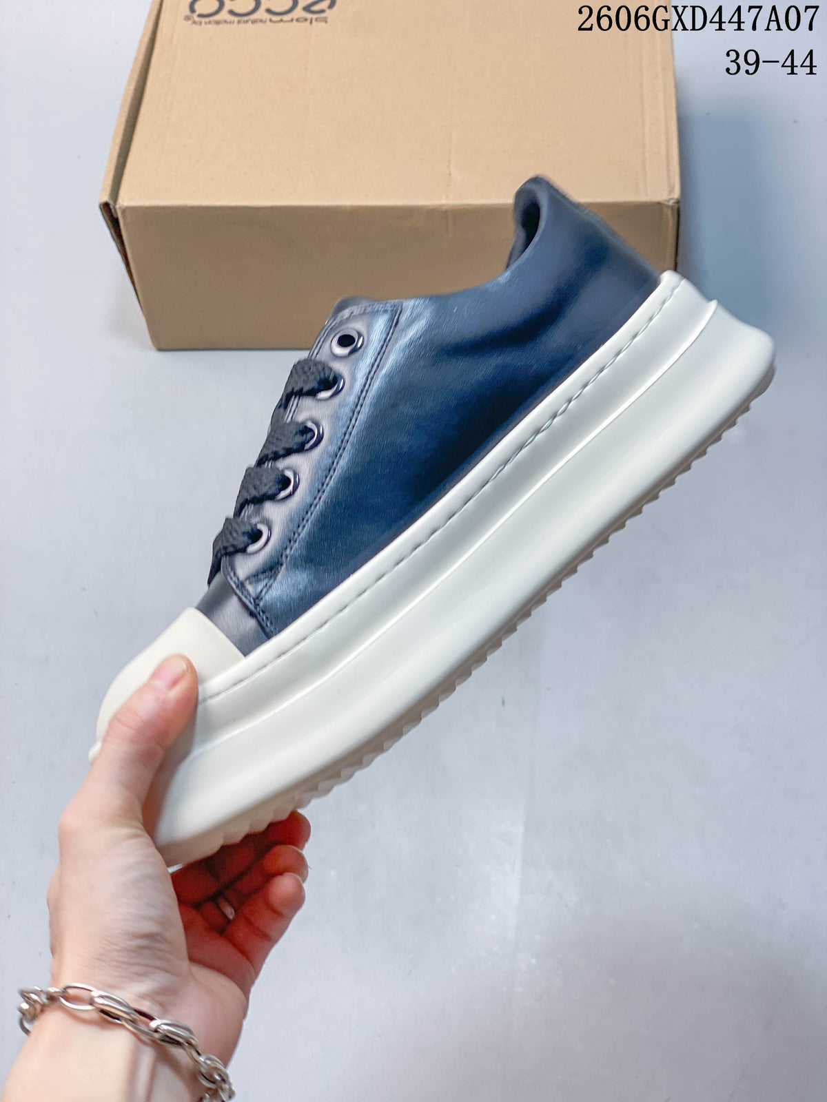 Side view of the navy sneaker with a white platform sole