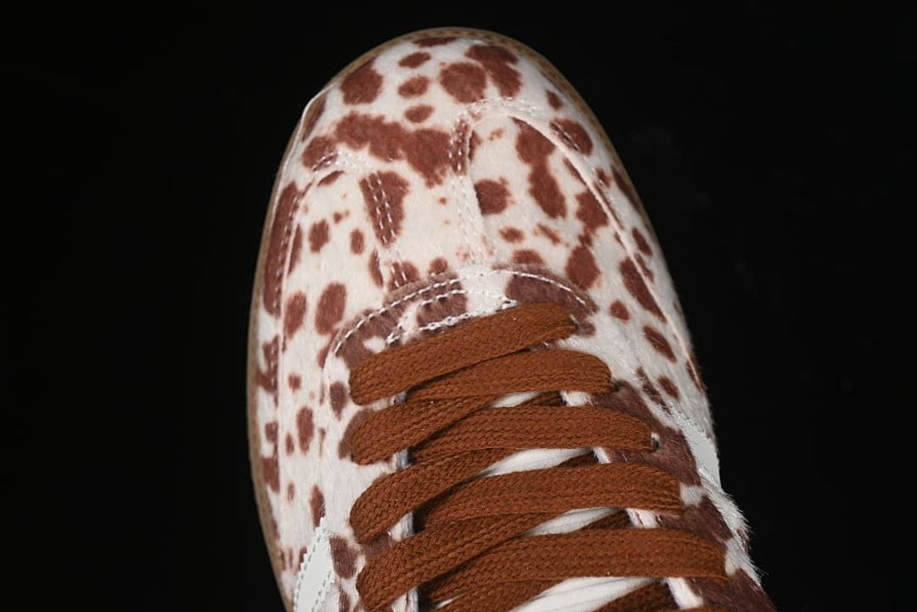 Top view of the spotted toe and brown lace-up front