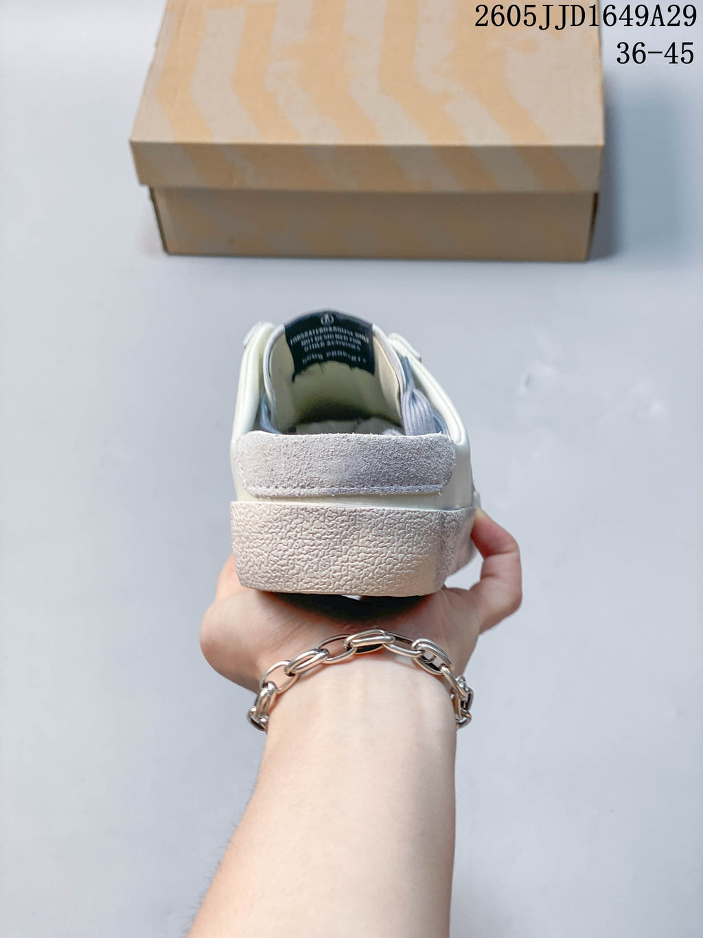 Rear view of the sneaker showing its open heel and textured sole