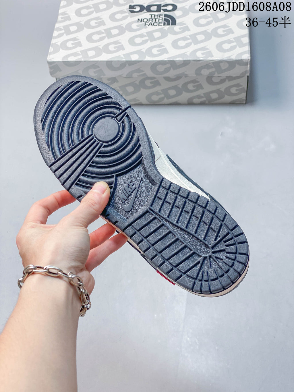Close-up of the sneaker's navy patterned outsole