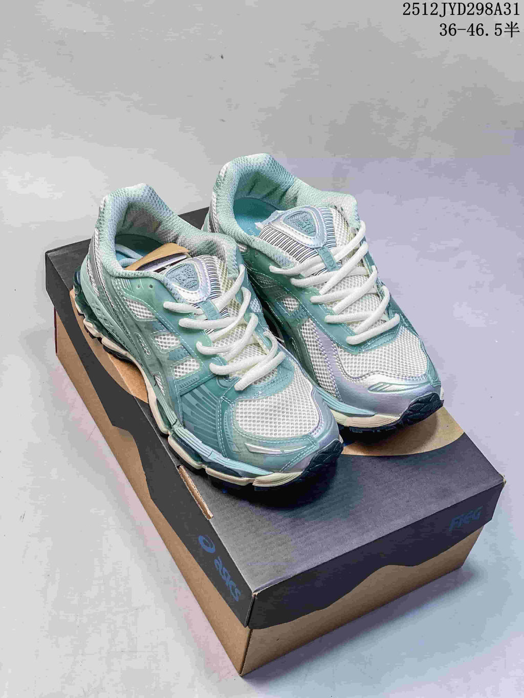 Pair of pale aqua and white layered running sneakers shown from the front.