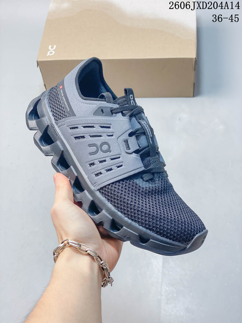 Side view of a gray On Cloudswift Amp shoe