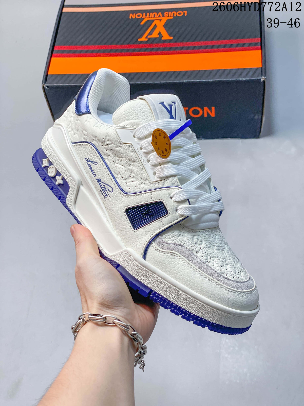 Angled view of the white and blue sneaker with textured panels