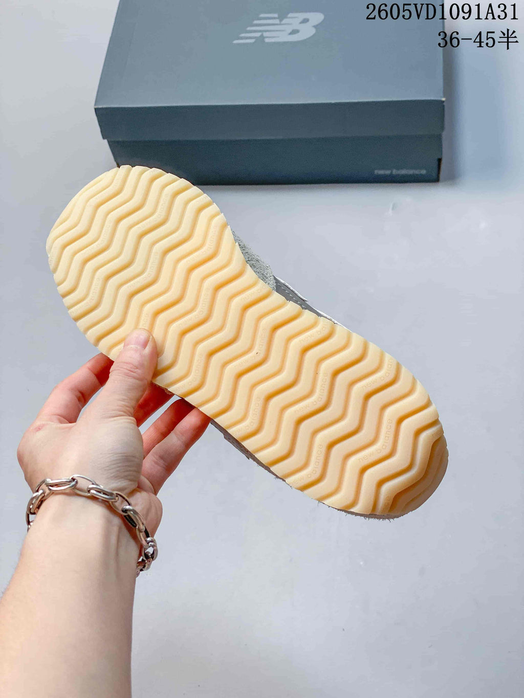 Close-up of the cream-colored wavy-tread outsole