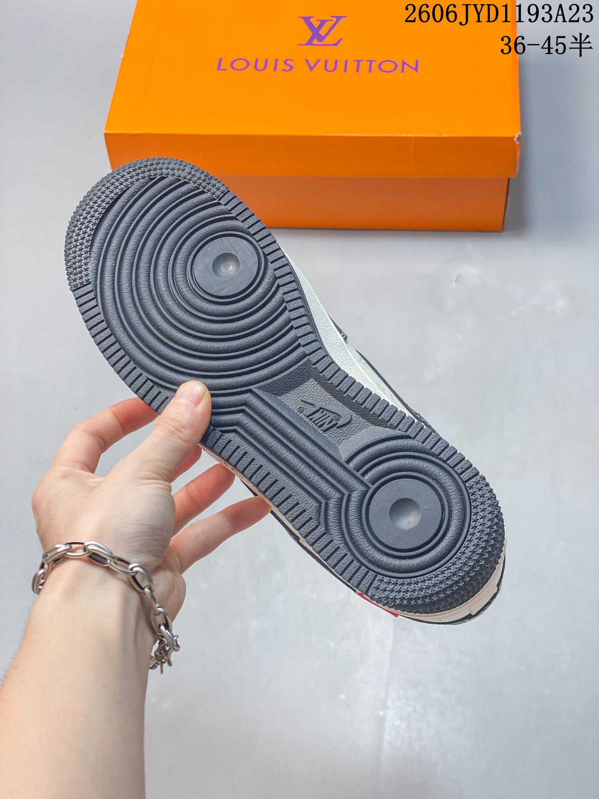 Close-up of the dark textured outsole and circular tread pattern