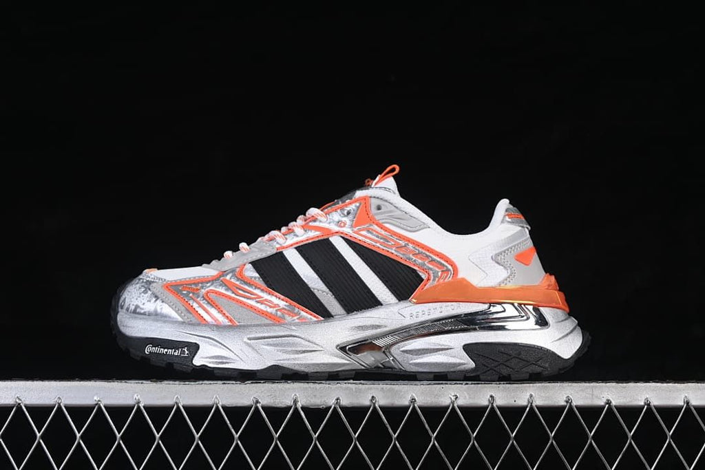 Side view of the white, silver, black, and orange adidas XLG Storm Edge sneaker