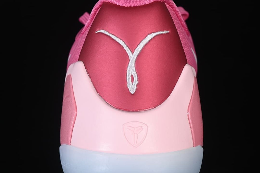 Rear view showing heel details and pink panels