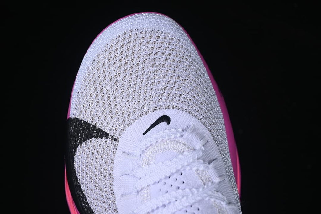 Top view of the shoe's knit-look toe and black Swoosh detail
