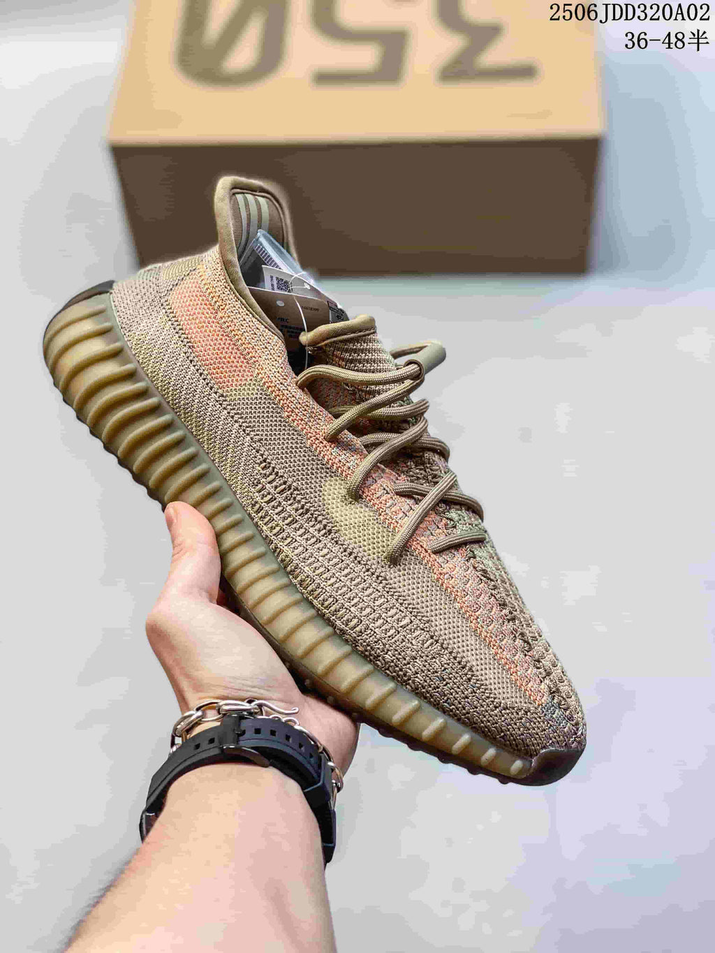 Tan and multicolor knit-look Adidas Yeezy-style sneaker with a ribbed tan sole
