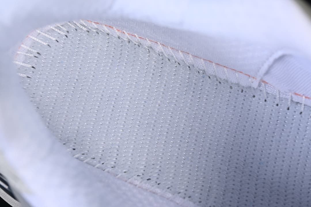 Close-up view inside the sneaker showing its stitched lining