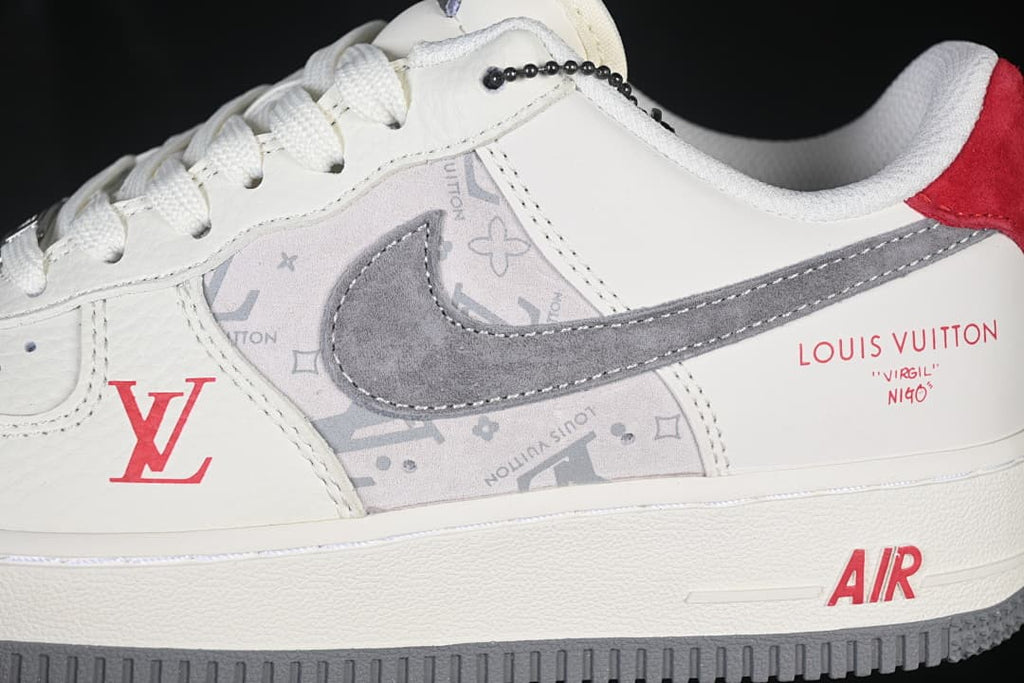 Side detail showing the gray Swoosh, patterned panel, and red accents
