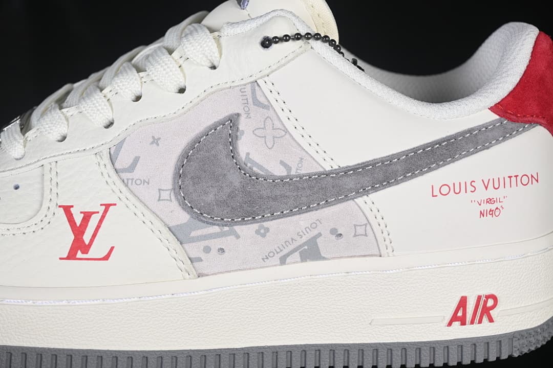 Side detail showing the gray Swoosh, patterned panel, and red accents