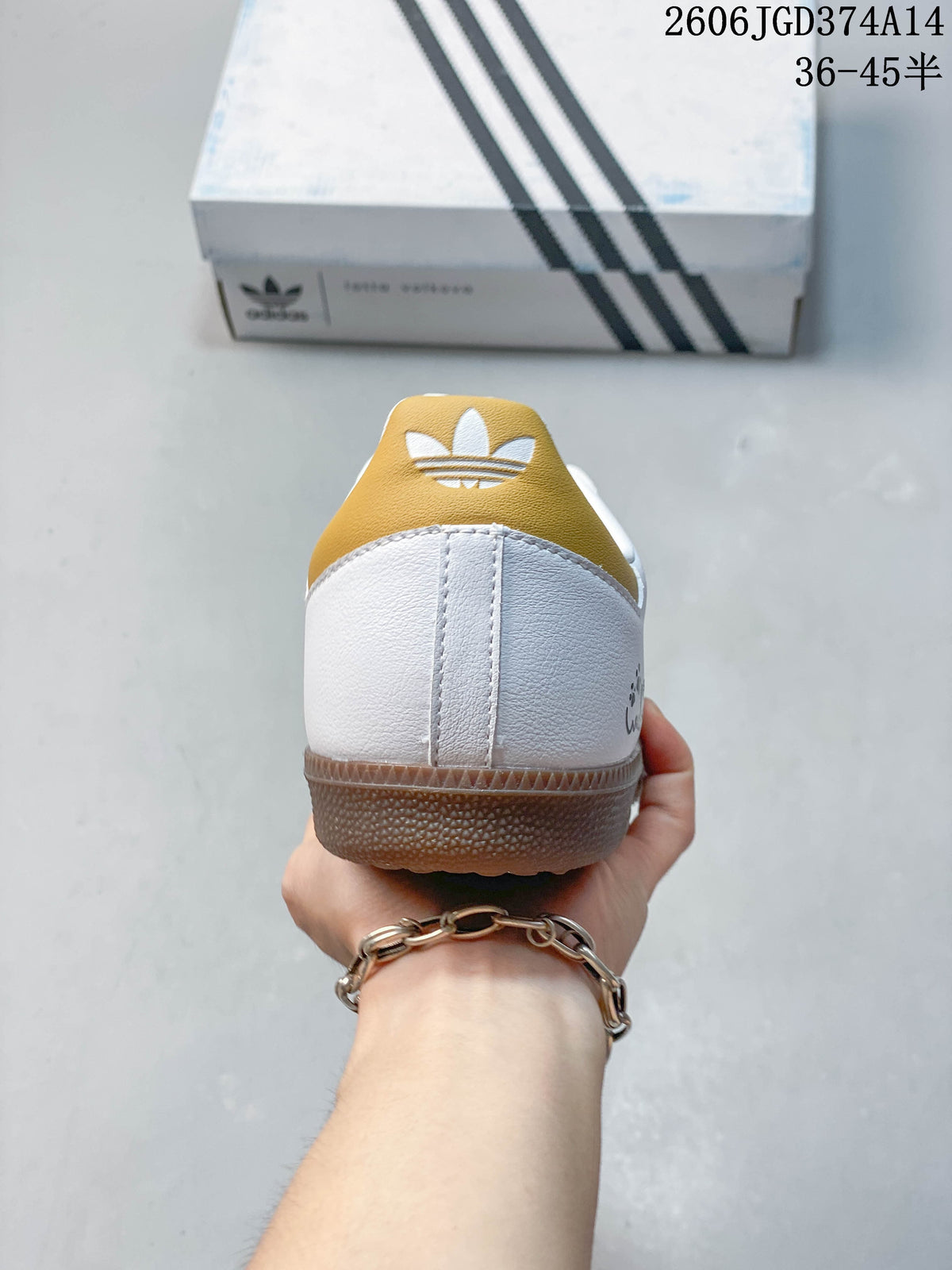 Rear view of the sneaker showing the gold-toned heel tab and brown outsole