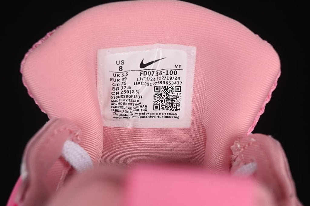 Close-up of the shoe tongue label showing size and style code FD0736-100