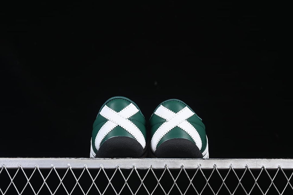 Rear view of both sneakers showing white crossed heel panels and black soles.