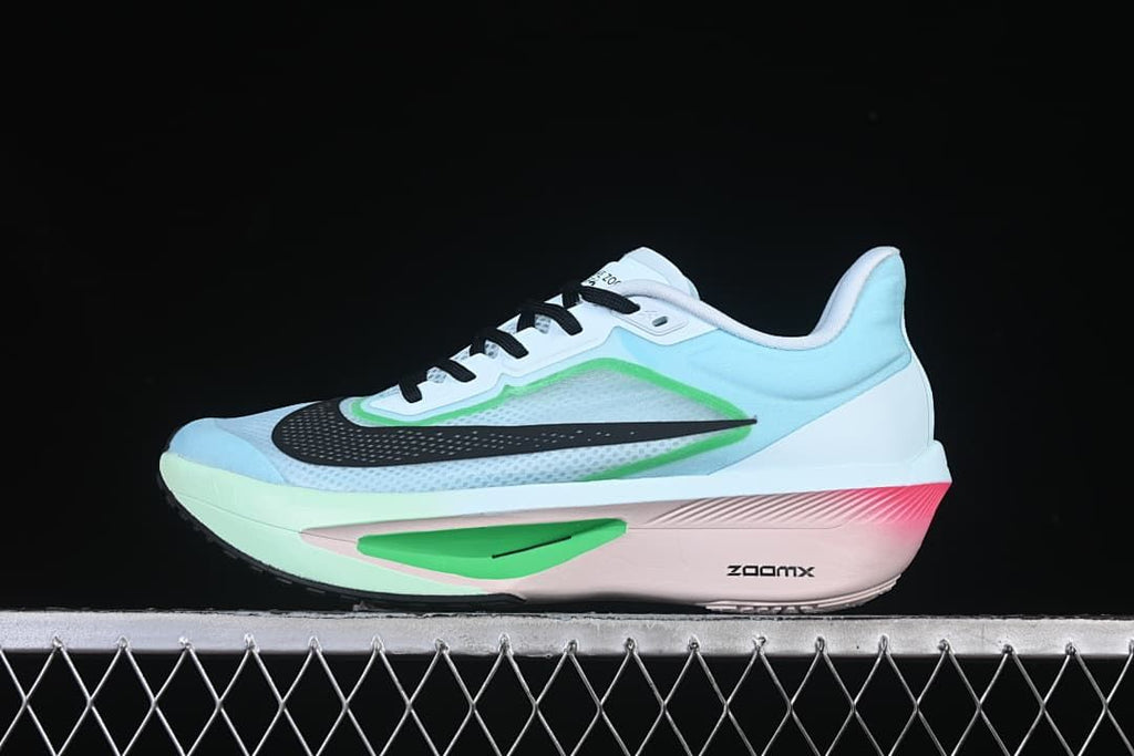 Side view of Nike Zoom Fly 6 running shoe in pale blue, white, green, black, and pink.