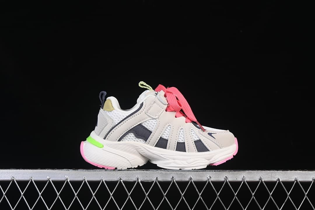 Side profile of one sneaker showing its gray, white, pink and lime green colorway.