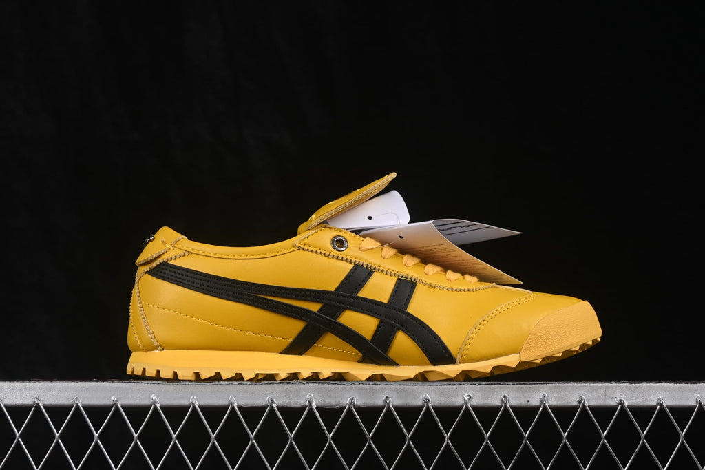 Side view showing the low-profile silhouette, black side stripes, yellow upper, and textured outsole