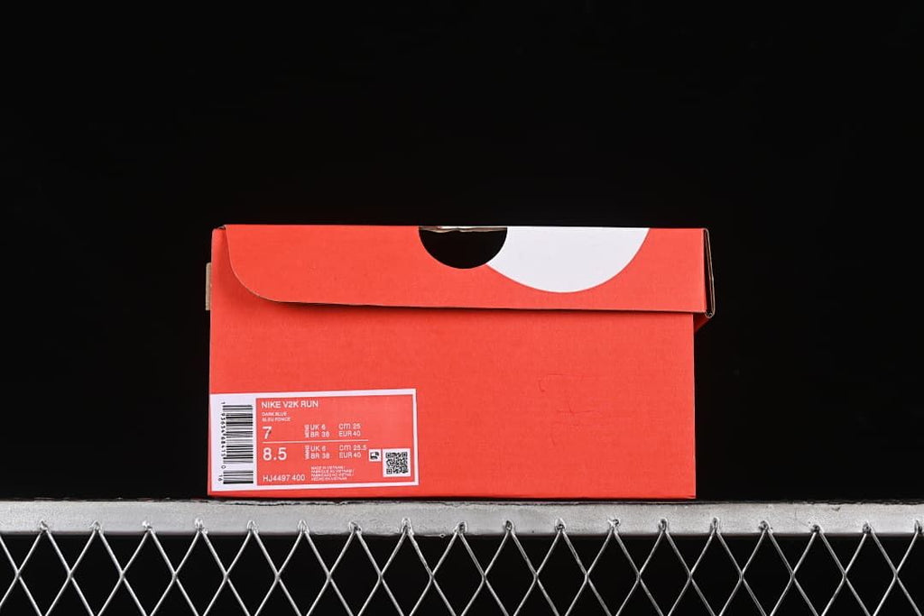 Shoe box label displaying Nike V2K Run, style code HJ4497-400 and size details