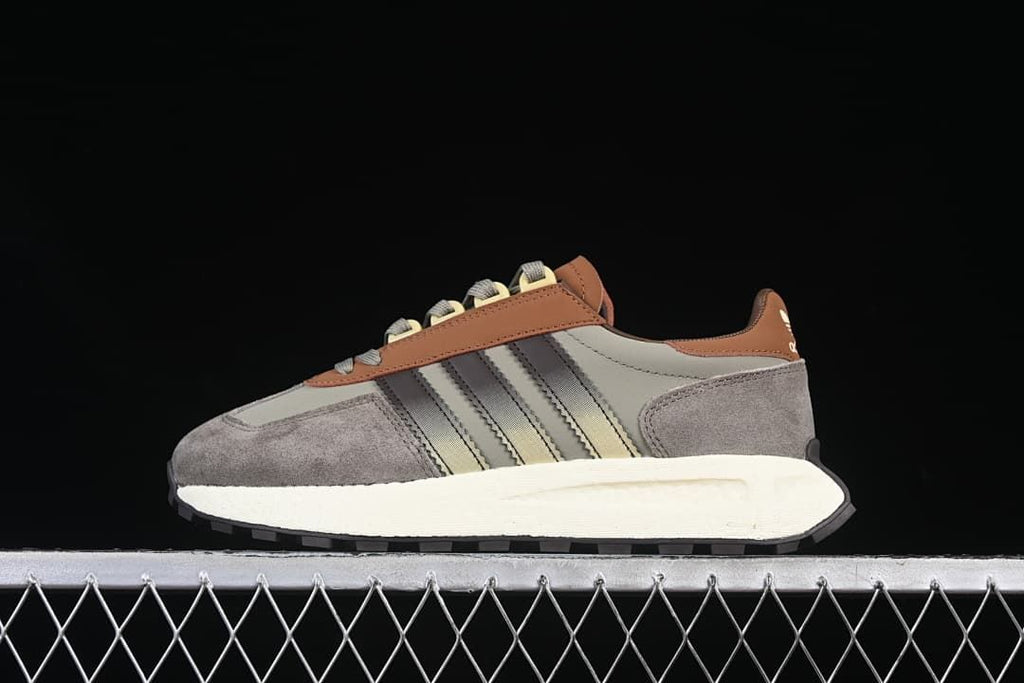 Side profile of the adidas Retropy E5 sneaker in grey, brown, and off-white