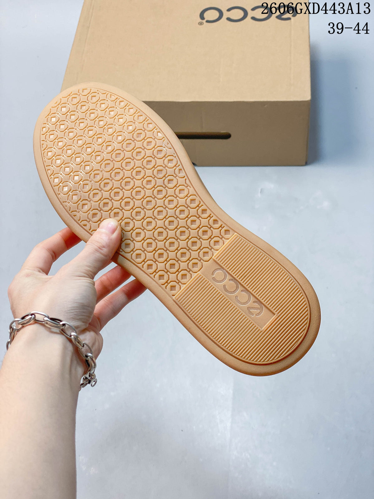 Close-up of the textured gum-colored outsole on the ECCO sneakers.
