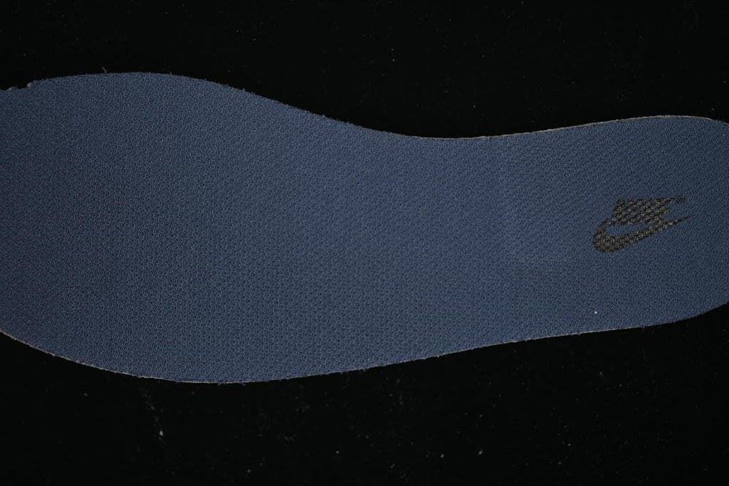 Blue shoe insert with a small Nike logo