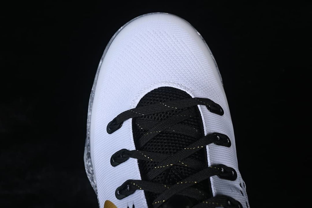 Top view of the white toe and black lacing