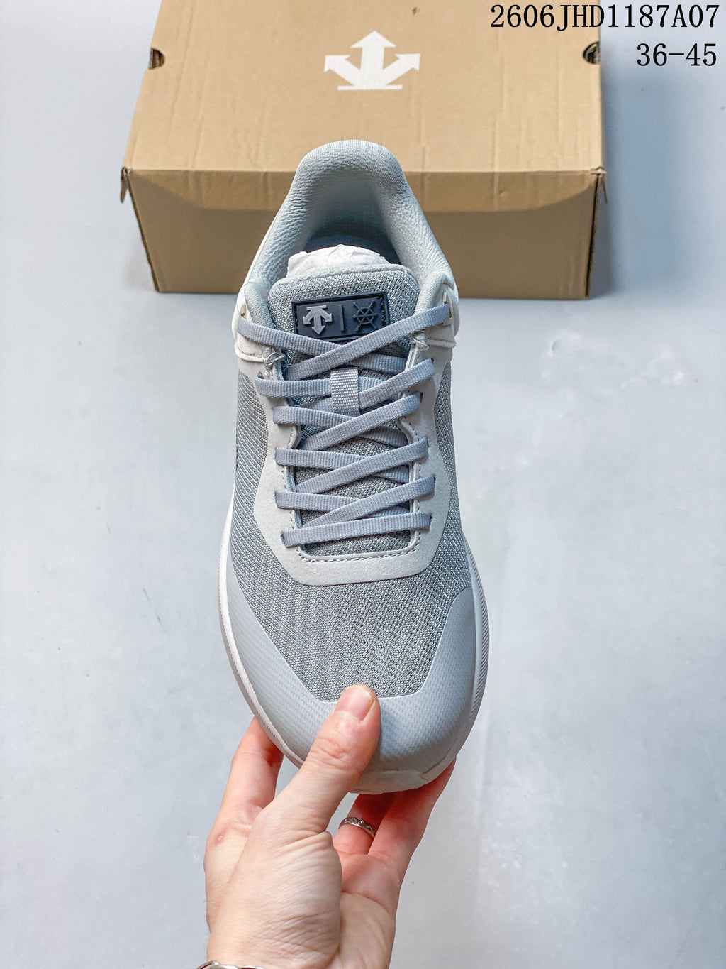 Top view showing the laces, tongue, and gray upper.