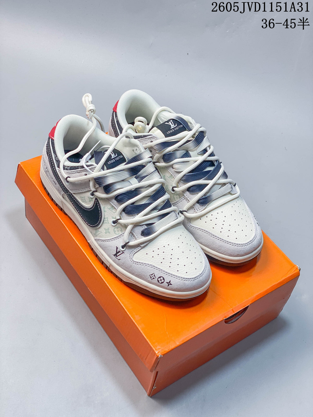 Several cream and gray low-top sneakers with patterned panels and contrasting swoosh-shaped overlays, displayed on an orange box.