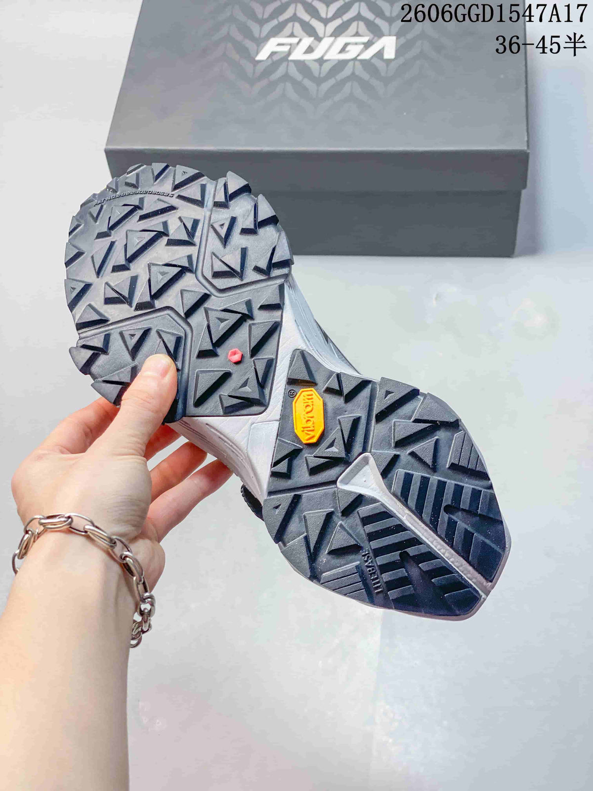 Close view of the shoe outsole showing a deep, angular lug pattern and a Vibram mark.