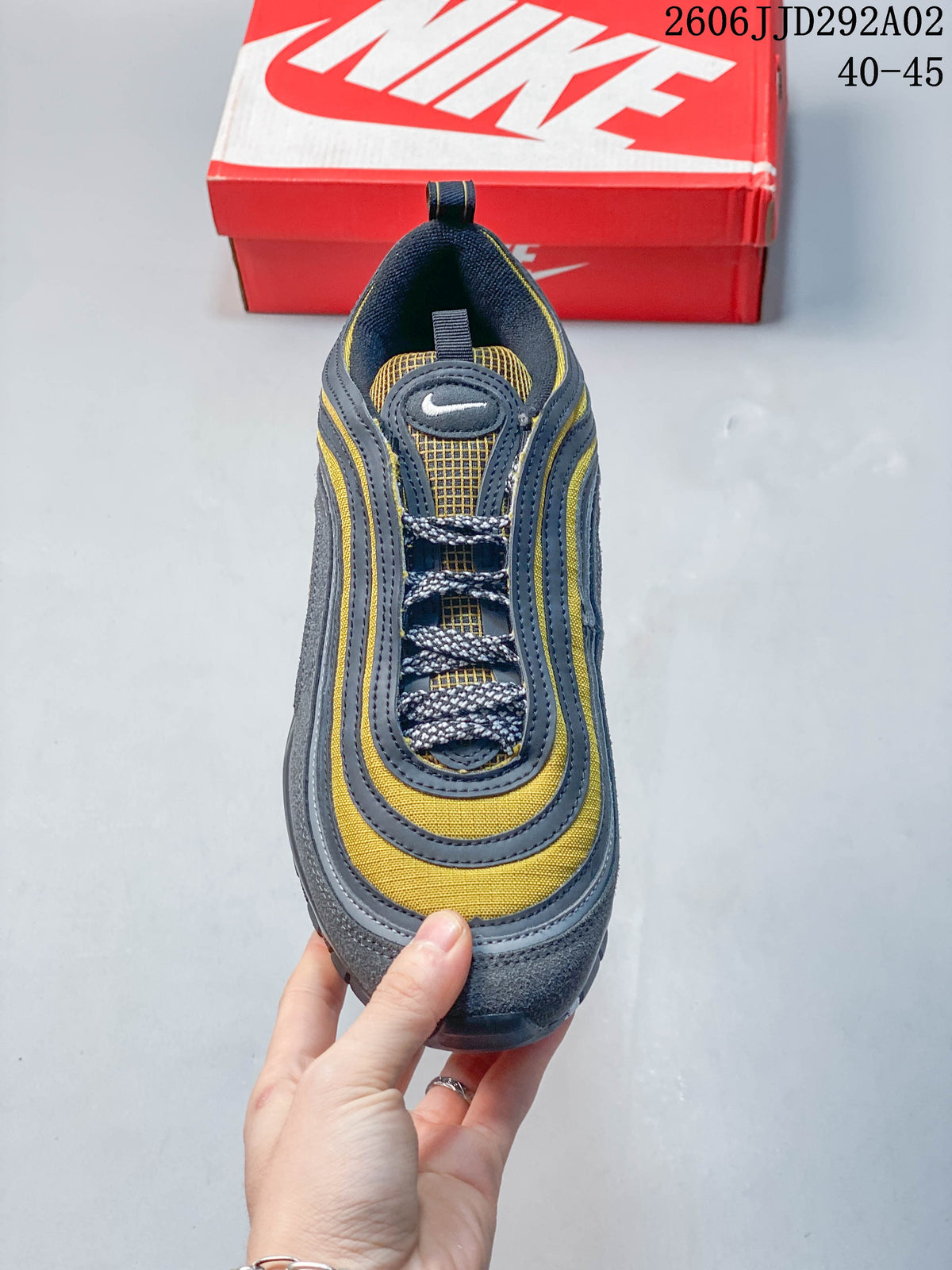 Front view of the Nike Air Max 97 showing its laces and layered upper
