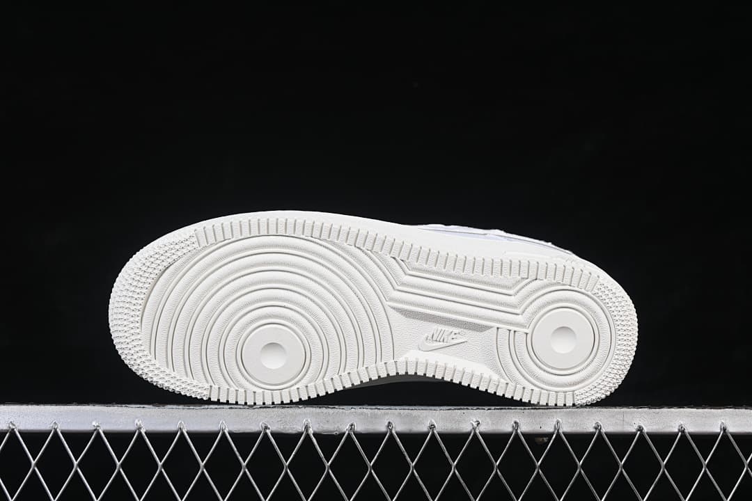 Underside view showing the circular outsole tread pattern.