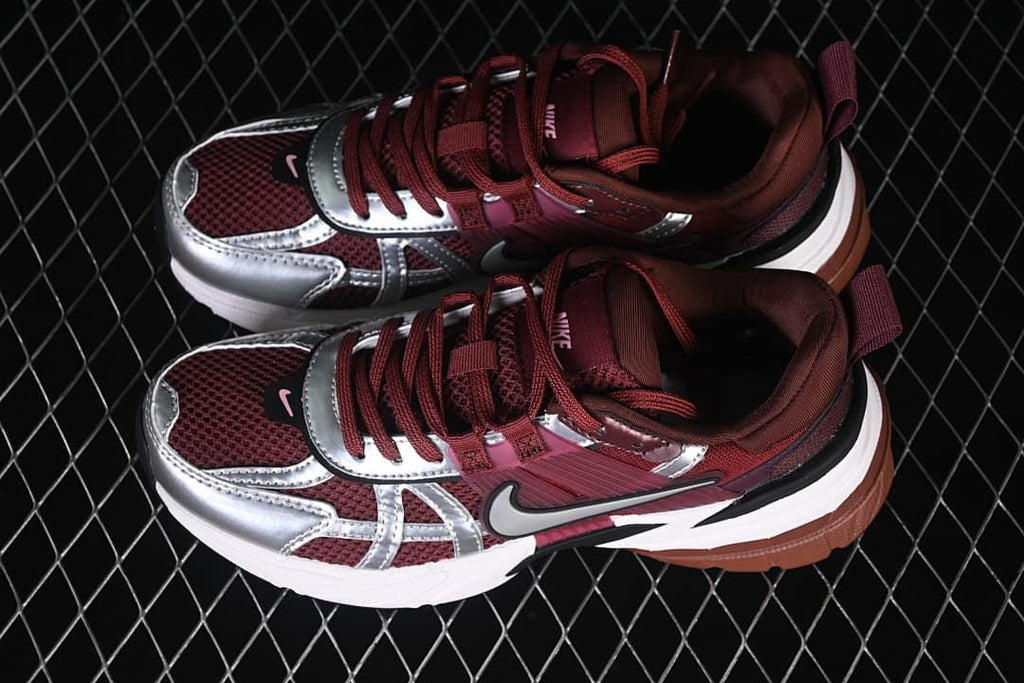 Pair of burgundy and silver Nike V2K Run sneakers shown from above