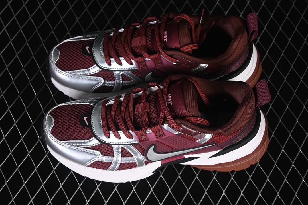 Pair of burgundy and silver Nike V2K Run sneakers shown from above