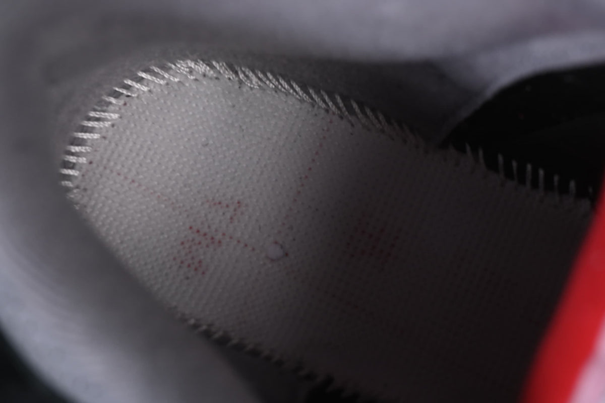 Close-up of the grey perforated lining inside the shoe