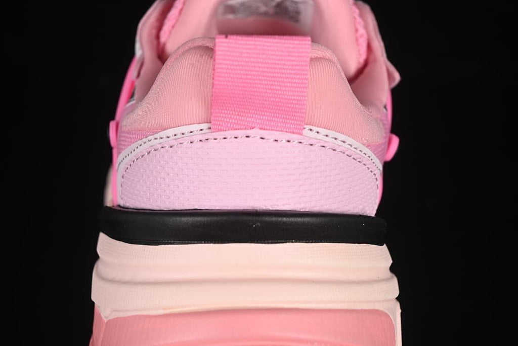 Rear view highlighting the pink heel and layered sole