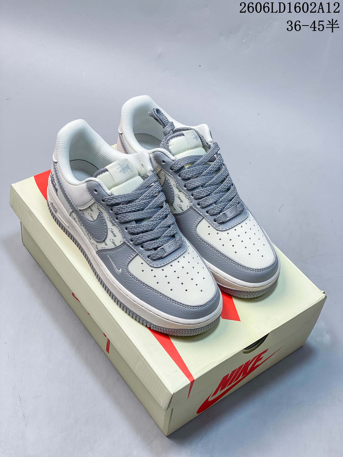 Pair of off-white and grey low-top sneakers with textured grey laces