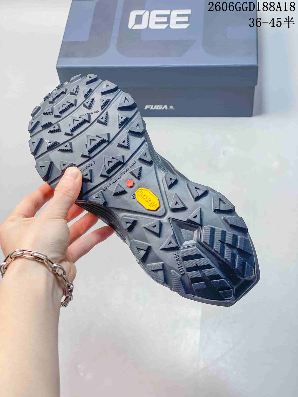 Close-up of the trail shoe outsole showing deep, multi-directional lugs