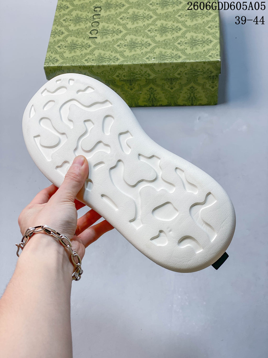 Close-up of the white outsole on a navy sneaker
