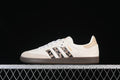 Side view of off-white adidas Samba OG sneakers with leopard-print stripes and dark brown soles