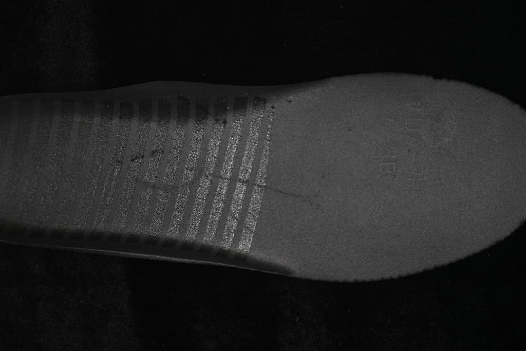 Close-up of the black rubber outsole.