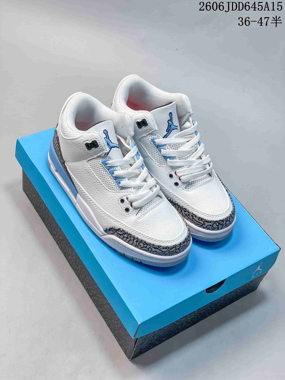 White and blue Air Jordan 3 Retro sneakers on a blue box, viewed from above.