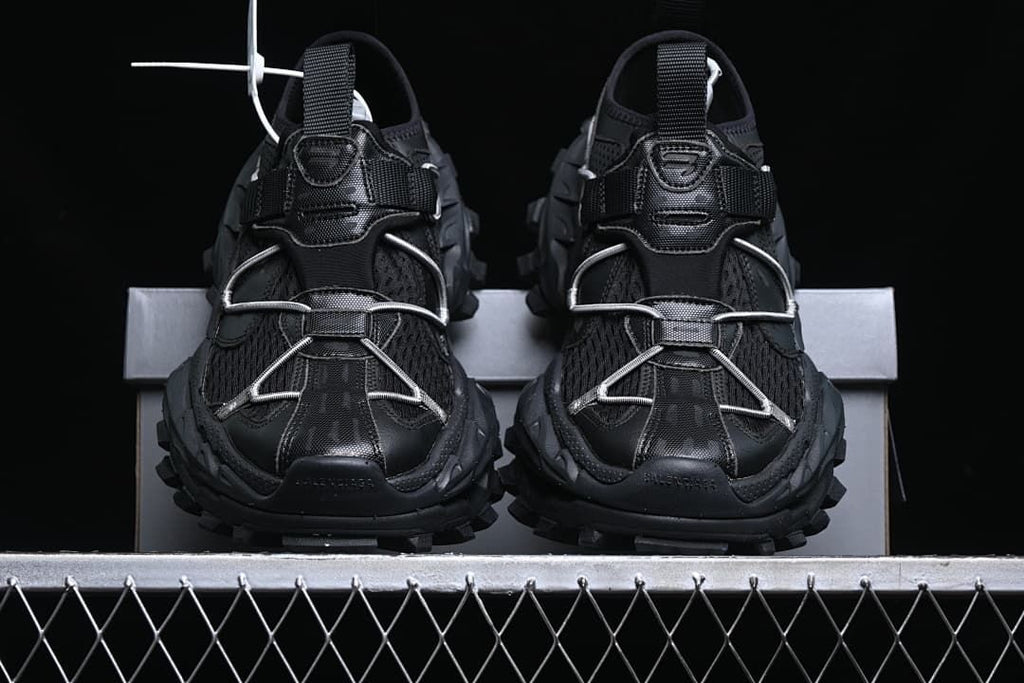 Front view of the pair showing cord lacing and rugged outsoles.