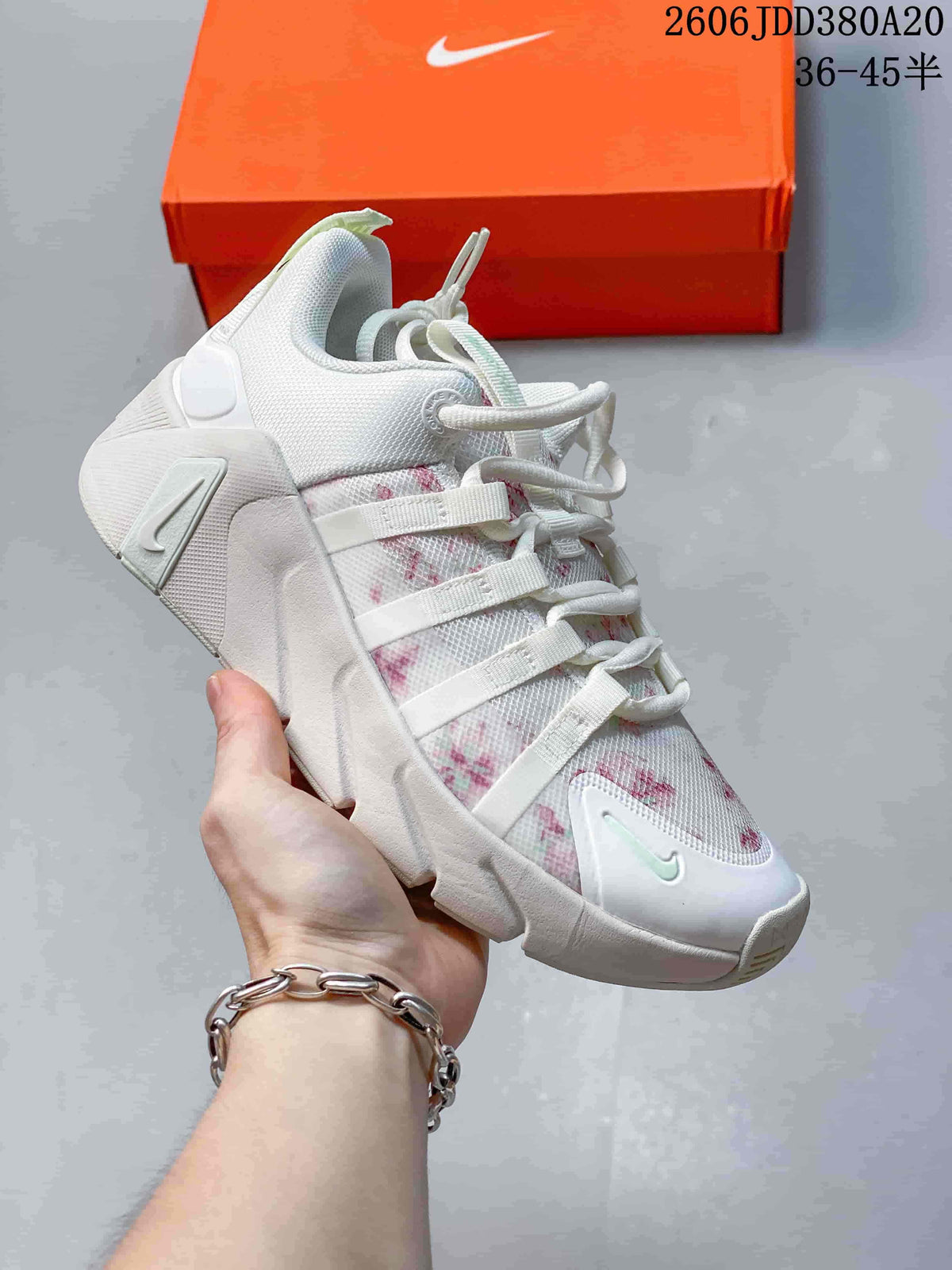 White Nike Free Metcon 7 shoe with a pink patterned upper