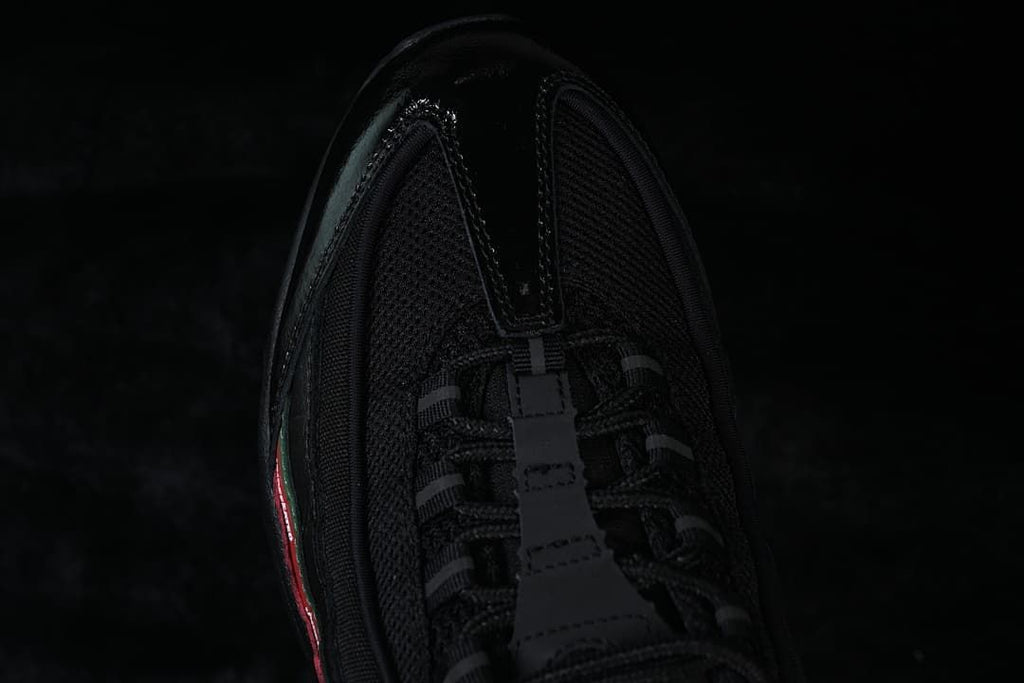 Top view of the black mesh toe and lacing