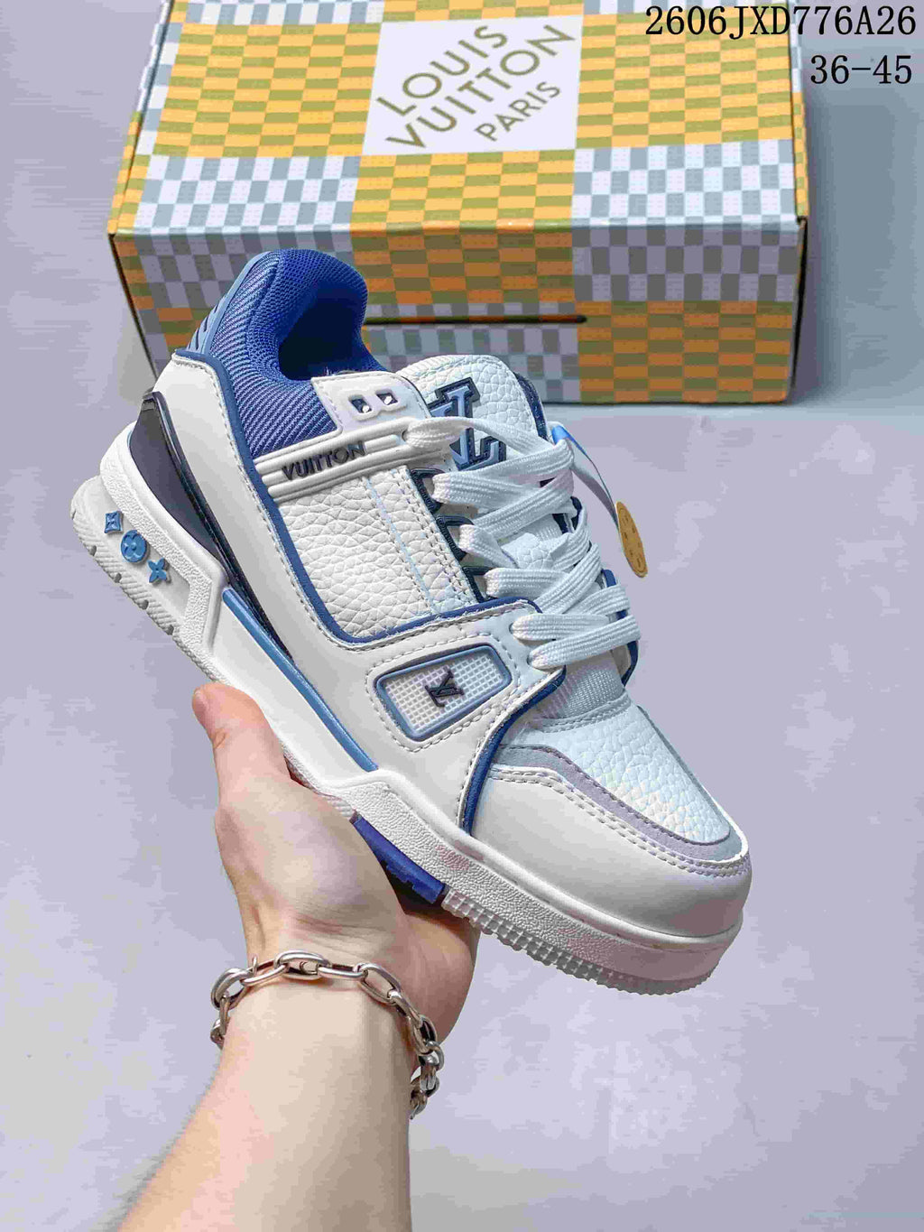 White and blue Louis Vuitton Trainer Low sneaker shown from the front side