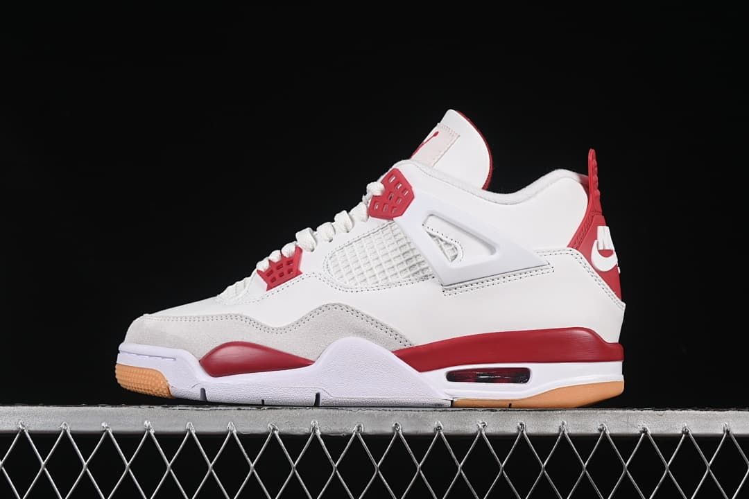 Side profile of a white and red Nike SB Air Jordan 4 sneaker