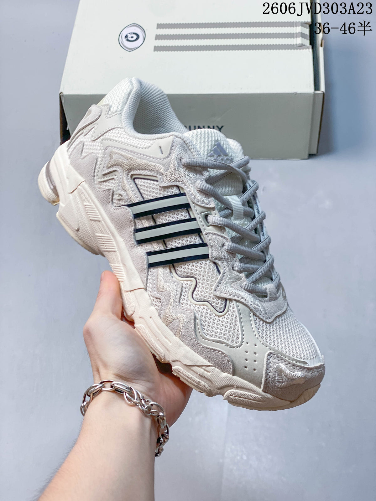Cream adidas Response CL sneaker with dark side stripes